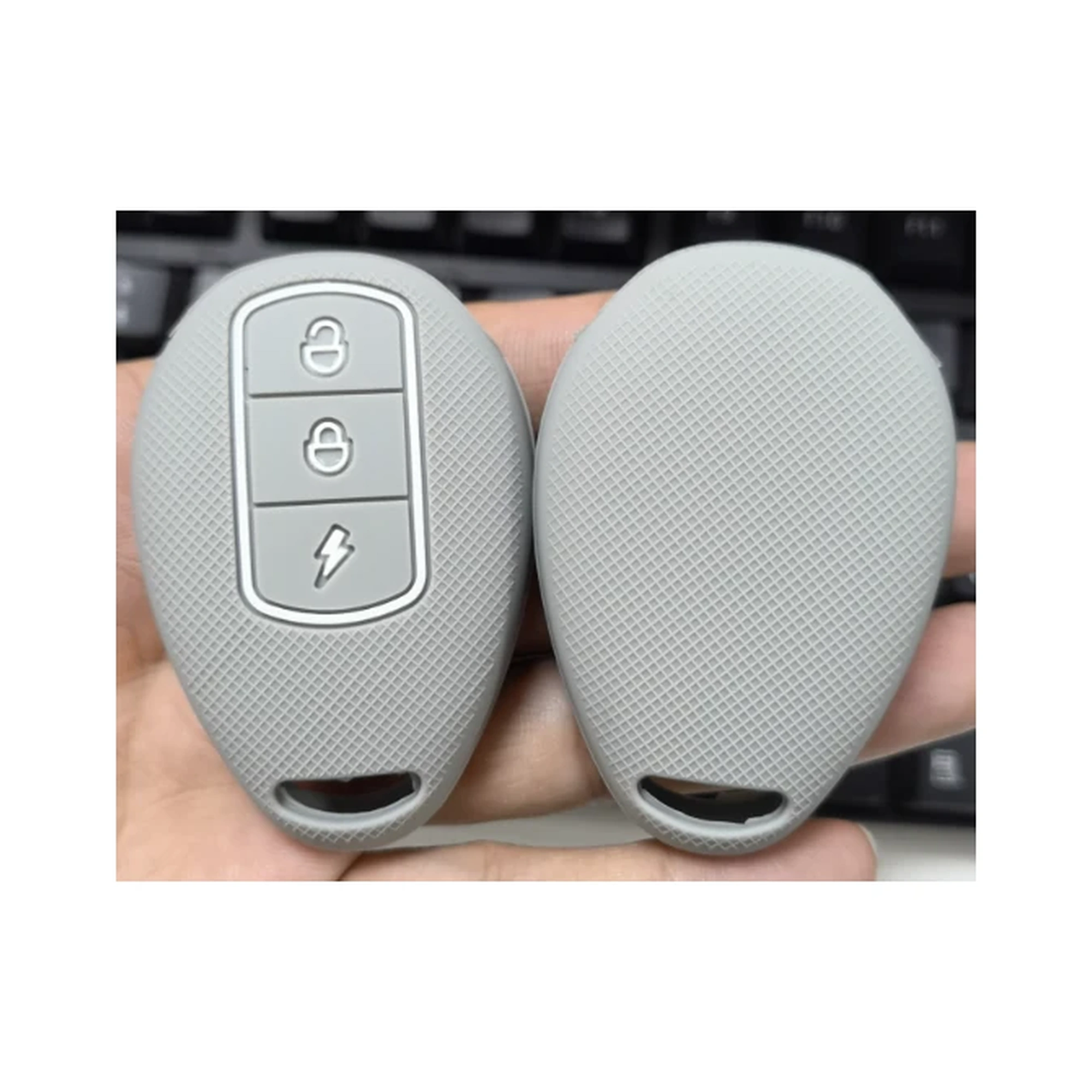 Tasten klassische Silikon-Schlüsselhülle (DD1202) — DD1202 classic silicone key cover from the 8.14 catalog source; compare the visible shape and button layout before ordering